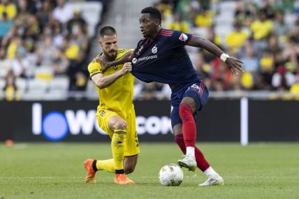 Sep 3, 2022; Columbus, Ohio, USA; Columbus Crew defender Milos Degenek (5) tries to pull Chicago Fire forward Jhon Duran (26) off the ball in the second half at Lower.com Field. Mandatory Credit: Greg Bartram-USA TODAY Sports