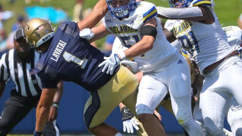 Delaware's Drew Nickles (51) and Artis Hemmingway (right) pressure Navy quarterback Tai Lavatai in the third quarter of the Blue Hens' 14-7 win at Navy-Marine Corps Memorial Stadium in Annapolis, Md., Saturday, Sept. 3, 2022.Ncaa Football Wil Hens Navy Gamer Delaware At Navy