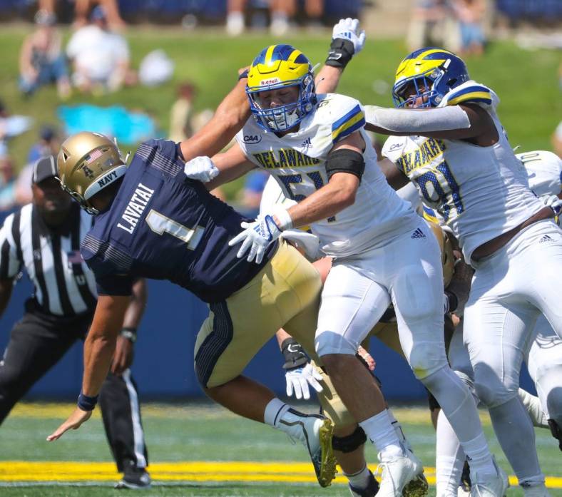 Delaware's Drew Nickles (51) and Artis Hemmingway (right) pressure Navy quarterback Tai Lavatai in the third quarter of the Blue Hens' 14-7 win at Navy-Marine Corps Memorial Stadium in Annapolis, Md., Saturday, Sept. 3, 2022.

Ncaa Football Wil Hens Navy Gamer Delaware At Navy