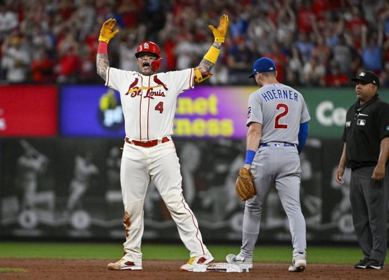 Sep 3, 2022; St. Louis, Missouri, USA;  St. Louis Cardinals catcher Yadier Molina (4) reacts after hitting a three run double against the Chicago Cubs during the third inning at Busch Stadium. Mandatory Credit: Jeff Curry-USA TODAY Sports
