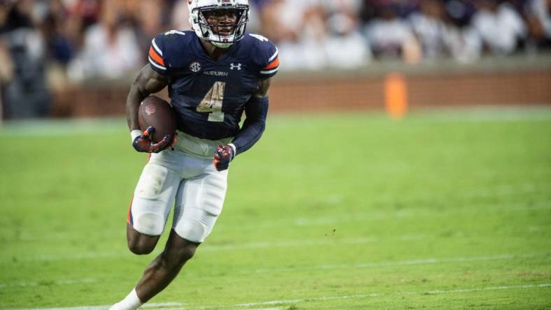 Auburn Tigers running back Tank Bigsby (4) runs the ball as Auburn Tigers take on Mercer Bears at Jordan-Hare Stadium in Auburn, Ala., on Saturday, Sept. 3, 2022. Auburn Tigers leads Mercer Bears 28-7 at halftime.