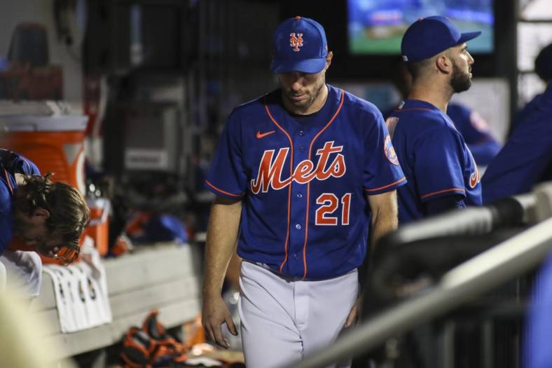 Sep 3, 2022; New York City, New York, USA;  New York Mets starting pitcher Max Scherzer (21) walks into the dugout after being taken out of the game against the Washington Nationals in the fifth inning at Citi Field. Mandatory Credit: Wendell Cruz-USA TODAY Sports