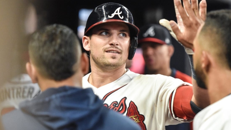 Sep 3, 2022; Cumberland, Georgia, USA; Atlanta Braves third baseman Austin Riley (27) celebrates with teammates after hitting a home run against the Miami Marlins in the fourth inning at Truist Park. Mandatory Credit: Larry Robinson-USA TODAY Sports