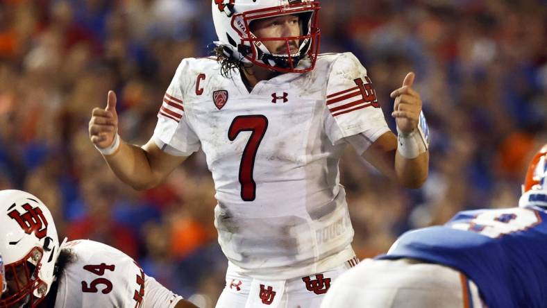 Sep 3, 2022; Gainesville, Florida, USA; Utah Utes quarterback Cameron Rising (7) calls a play against the Florida Gators during the second half at Steve Spurrier-Florida Field. Mandatory Credit: Kim Klement-USA TODAY Sports