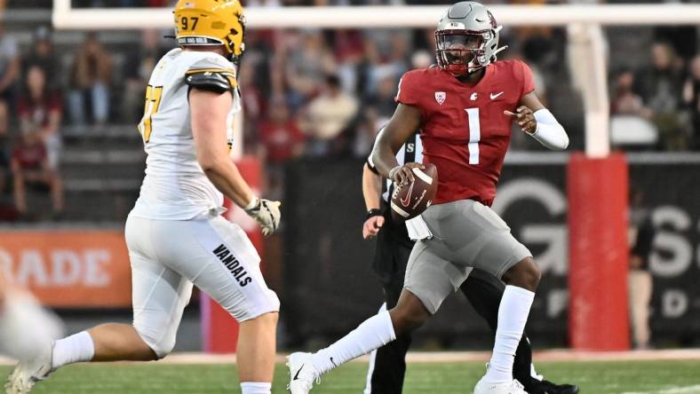 Sep 3, 2022; Pullman, Washington, USA; Washington State Cougars quarterback Cameron Ward (1) is forced out of the pocket by Idaho Vandals defensive lineman Zach Krotzer (96) in the first half at Gesa Field at Martin Stadium. Mandatory Credit: James Snook-USA TODAY Sports