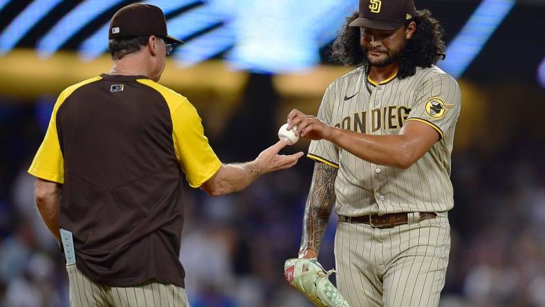 Sep 3, 2022; Los Angeles, California, USA; San Diego Padres starting pitcher Sean Manaea (55) is pulled from the game by manager Bob Melvin (3) against the Los Angeles Dodgers during the fifth inning at Dodger Stadium. Mandatory Credit: Gary A. Vasquez-USA TODAY Sports