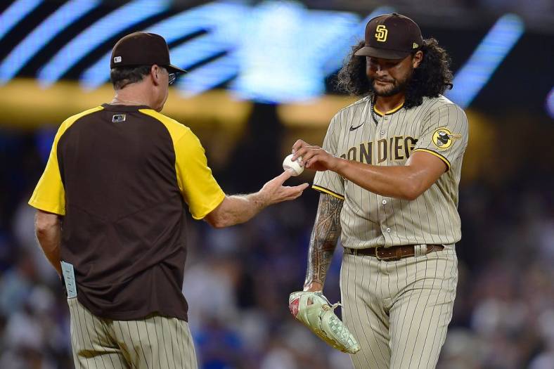 Sep 3, 2022; Los Angeles, California, USA; San Diego Padres starting pitcher Sean Manaea (55) is pulled from the game by manager Bob Melvin (3) against the Los Angeles Dodgers during the fifth inning at Dodger Stadium. Mandatory Credit: Gary A. Vasquez-USA TODAY Sports