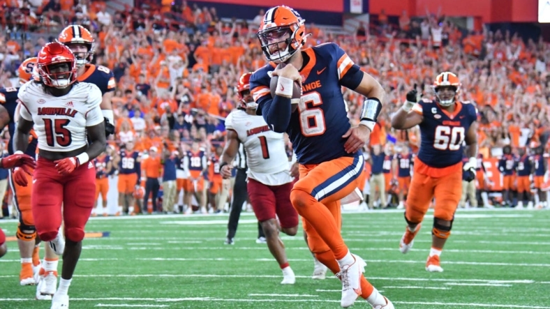 Sep 3, 2022; Syracuse, New York, USA; Syracuse Orange quarterback Garrett Shrader (6) runs for a touchdown against the Louisville Cardinals in the fourth quarter at JMA Wireless Dome. Mandatory Credit: Mark Konezny-USA TODAY Sports