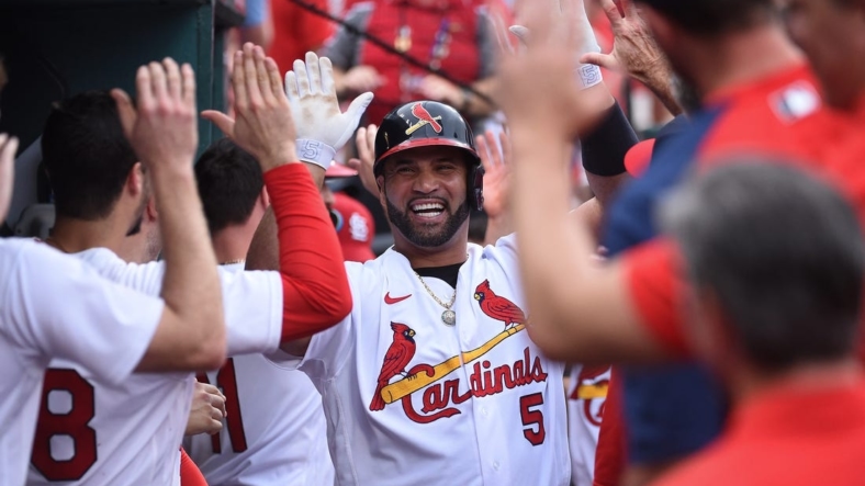 Sep 4, 2022; St. Louis, Missouri, USA; St. Louis Cardinals pinch hitter Albert Pujols (5) is greeted after hitting a two run home run against the Chicago Cubs in the eighth inning at Busch Stadium. Mandatory Credit: Joe Puetz-USA TODAY Sports