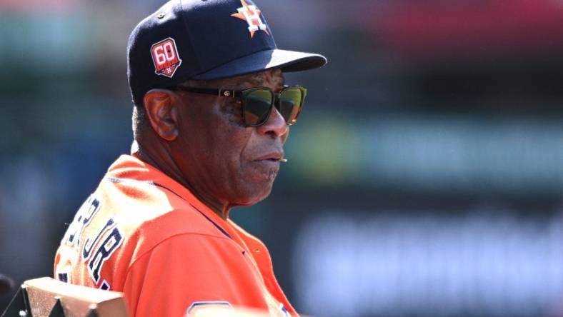 Sep 4, 2022; Anaheim, California, USA; Houston Astros manager Dusty Baker Jr. (12) looks on from the dugout during the ninth inning against the Los Angeles Angels at Angel Stadium. Mandatory Credit: Orlando Ramirez-USA TODAY Sports