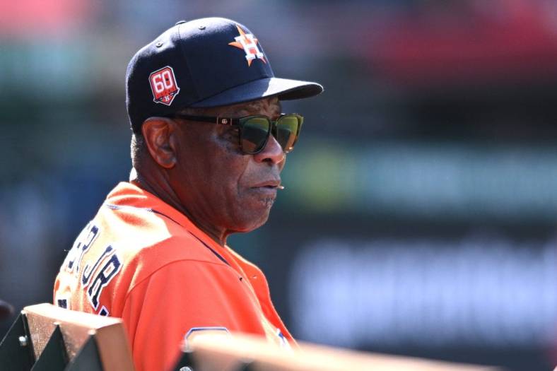 Sep 4, 2022; Anaheim, California, USA; Houston Astros manager Dusty Baker Jr. (12) looks on from the dugout during the ninth inning against the Los Angeles Angels at Angel Stadium. Mandatory Credit: Orlando Ramirez-USA TODAY Sports