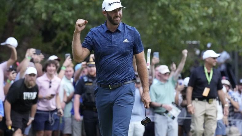 Sep 4, 2022; Boston, Massachusetts, USA; Dustin Johnson celebrates with a fist punch after putting to win the 2022 LIV Golf Invitational Boston after the final round playoff hole of the LIV Golf tournament at The International. Mandatory Credit: Richard Cashin-USA TODAY Sports