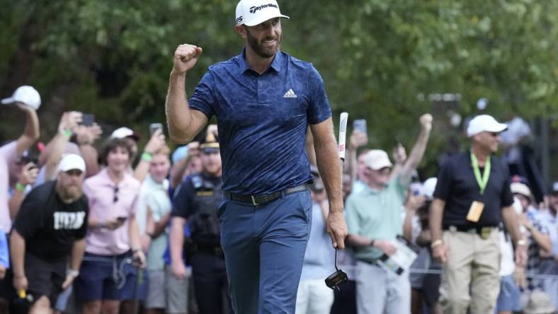 Sep 4, 2022; Boston, Massachusetts, USA; Dustin Johnson celebrates with a fist punch after putting to win the 2022 LIV Golf Invitational Boston after the final round playoff hole of the LIV Golf tournament at The International. Mandatory Credit: Richard Cashin-USA TODAY Sports