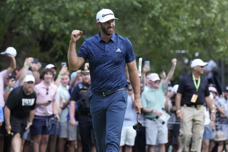 Sep 4, 2022; Boston, Massachusetts, USA; Dustin Johnson celebrates with a fist punch after putting to win the 2022 LIV Golf Invitational Boston after the final round playoff hole of the LIV Golf tournament at The International. Mandatory Credit: Richard Cashin-USA TODAY Sports
