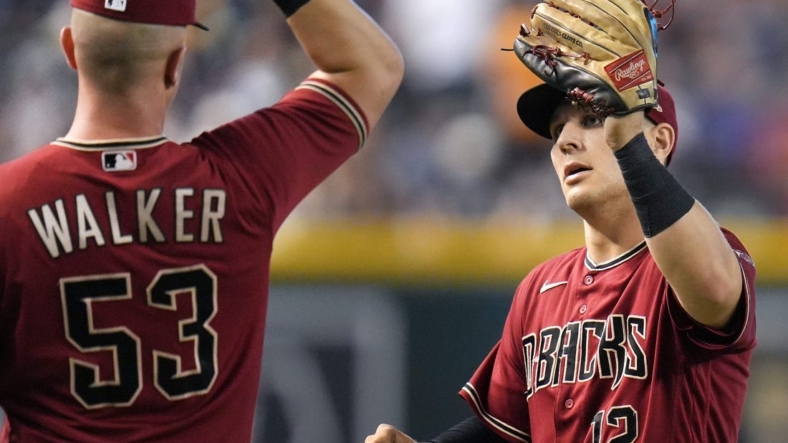 Sep 4, 2022; Phoenix, AZ, USA; Arizona Diamondbacks' Christian Walker (53) high-fives Daulton Varsho (12) after his catch in the outfield against the Milwaukee Brewers at Chase Field. Mandatory Credit: Joe Rondone-Arizona RepublicMlb Brewers At D Backs