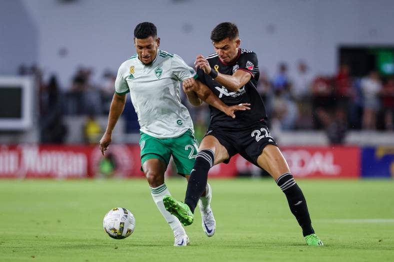 Sep 4, 2022; Washington, District of Columbia, USA; Colorado Rapids midfielder Bryan Acosta (21) and D.C. United forward Miguel Berry (22) battle for the ball during the first half at Audi Field. Mandatory Credit: Scott Taetsch-USA TODAY Sports