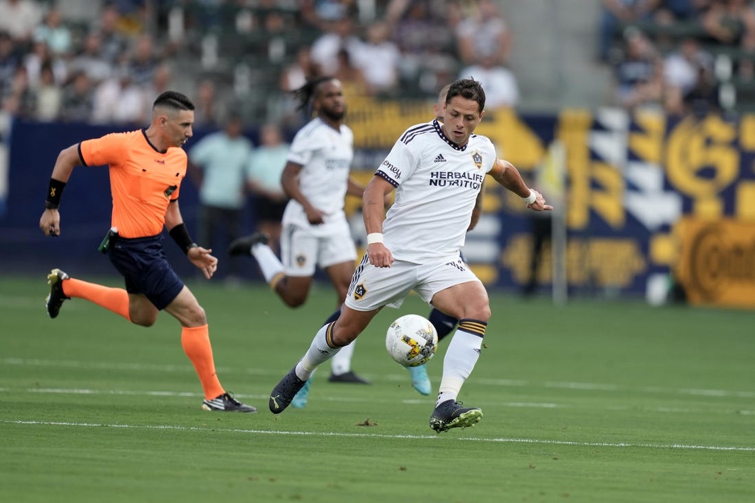 Sep 4, 2022; Carson, California, USA; LA Galaxy forward Javier Hernandez (14) kicks the ball against Sporting Kansas City in the first half at Dignity Health Sports Park. Mandatory Credit: Kirby Lee-USA TODAY Sports