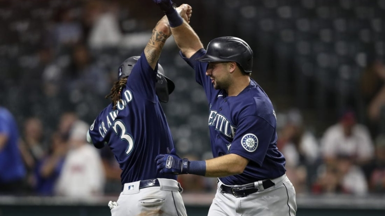 Sep 4, 2022; Cleveland, Ohio, USA; Seattle Mariners catcher Cal Raleigh (29) celebrates with short stop J.P. Crawford (3) after hitting a two run home run against the Cleveland Guardians in the eleventh inning at Progressive Field. Mandatory Credit: Aaron Josefczyk-USA TODAY Sports