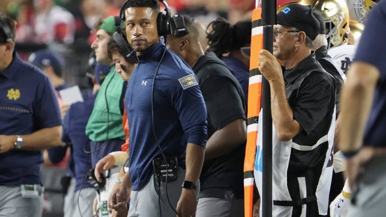 Sep 3, 2022; Columbus, Ohio, USA;  Notre Dame Fighting Irish head coach Marcus Freeman watches from the sideline during the NCAA football game against the Ohio State Buckeyes at Ohio Stadium. Mandatory Credit: Adam Cairns-USA TODAY Sports