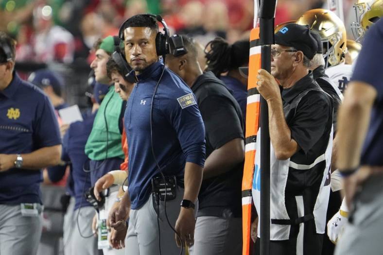Sep 3, 2022; Columbus, Ohio, USA;  Notre Dame Fighting Irish head coach Marcus Freeman watches from the sideline during the NCAA football game against the Ohio State Buckeyes at Ohio Stadium. Mandatory Credit: Adam Cairns-USA TODAY Sports