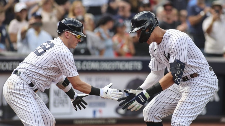 Sep 5, 2022; Bronx, New York, USA;  New York Yankees center fielder Aaron Judge (99) is greeted by New York Yankees third baseman Josh Donaldson (28) after hitting a two run home run in the sixth inning against the Minnesota Twins at Yankee Stadium. Mandatory Credit: Wendell Cruz-USA TODAY Sports
