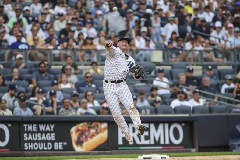 Sep 5, 2022; Bronx, New York, USA;  New York Yankees third baseman Josh Donaldson (28) makes a leaping throw to complete an inning ending double play in the seventh inning against the Minnesota Twins at Yankee Stadium. Mandatory Credit: Wendell Cruz-USA TODAY Sports