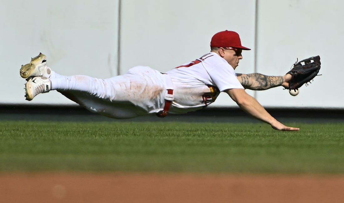 Sep 5, 2022; St. Louis, Missouri, USA;  St. Louis Cardinals center fielder Tyler O'Neill (27) dives but is unable to catch a triple hit by Washington Nationals shortstop CJ Abrams (not pictured) during the third inning at Busch Stadium. Mandatory Credit: Jeff Curry-USA TODAY Sports