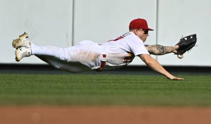 Sep 5, 2022; St. Louis, Missouri, USA;  St. Louis Cardinals center fielder Tyler O'Neill (27) dives but is unable to catch a triple hit by Washington Nationals shortstop CJ Abrams (not pictured) during the third inning at Busch Stadium. Mandatory Credit: Jeff Curry-USA TODAY Sports