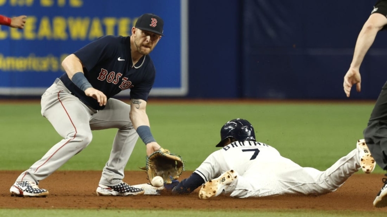 Sep 5, 2022; St. Petersburg, Florida, USA; Tampa Bay Rays second baseman Vidal Brujan (7) steals second base as Boston Red Sox second baseman Trevor Story (10) attempted to tag him out during the seventh inning at Tropicana Field. Mandatory Credit: Kim Klement-USA TODAY Sports