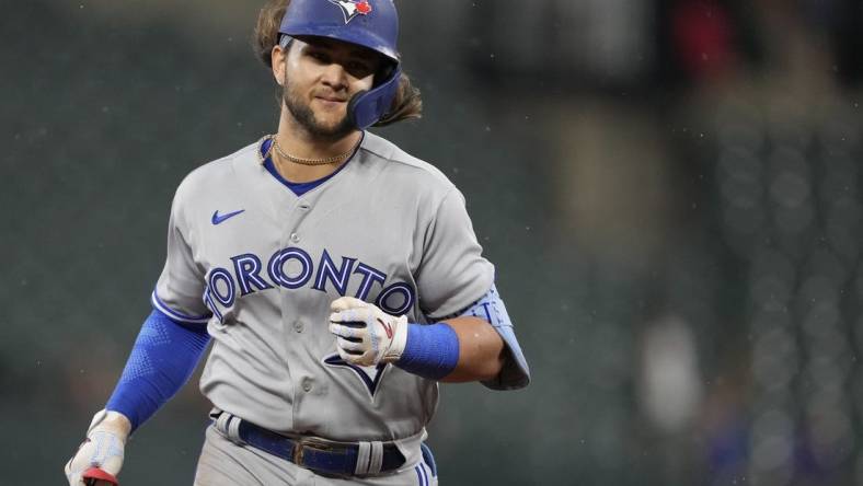 Sep 5, 2022; Baltimore, Maryland, USA; Toronto Blue Jays shortstop Bo Bichette (11) runs after hitting a home run during the seventh inning against the Baltimore Orioles at Oriole Park at Camden Yards. Mandatory Credit: Brent Skeen-USA TODAY Sports