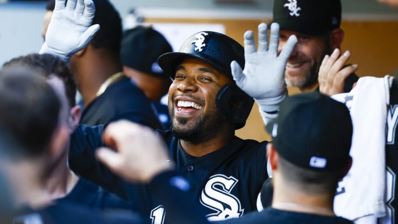 Sep 5, 2022; Seattle, Washington, USA; Chicago White Sox shortstop Elvis Andrus (1) high-fives teammates in the dugout after hitting a two-run home run against the Seattle Mariners during the third inning at T-Mobile Park. Mandatory Credit: Joe Nicholson-USA TODAY Sports