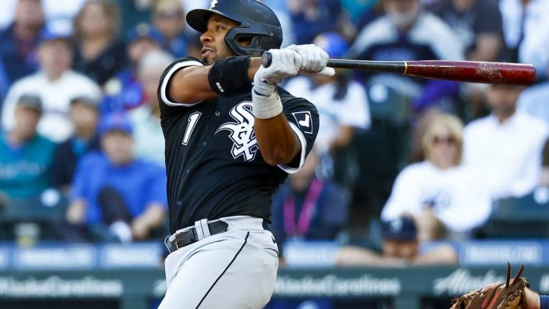 Sep 5, 2022; Seattle, Washington, USA; Chicago White Sox shortstop Elvis Andrus (1) hits a double against the Seattle Mariners during the fifth inning at T-Mobile Park. Mandatory Credit: Joe Nicholson-USA TODAY Sports