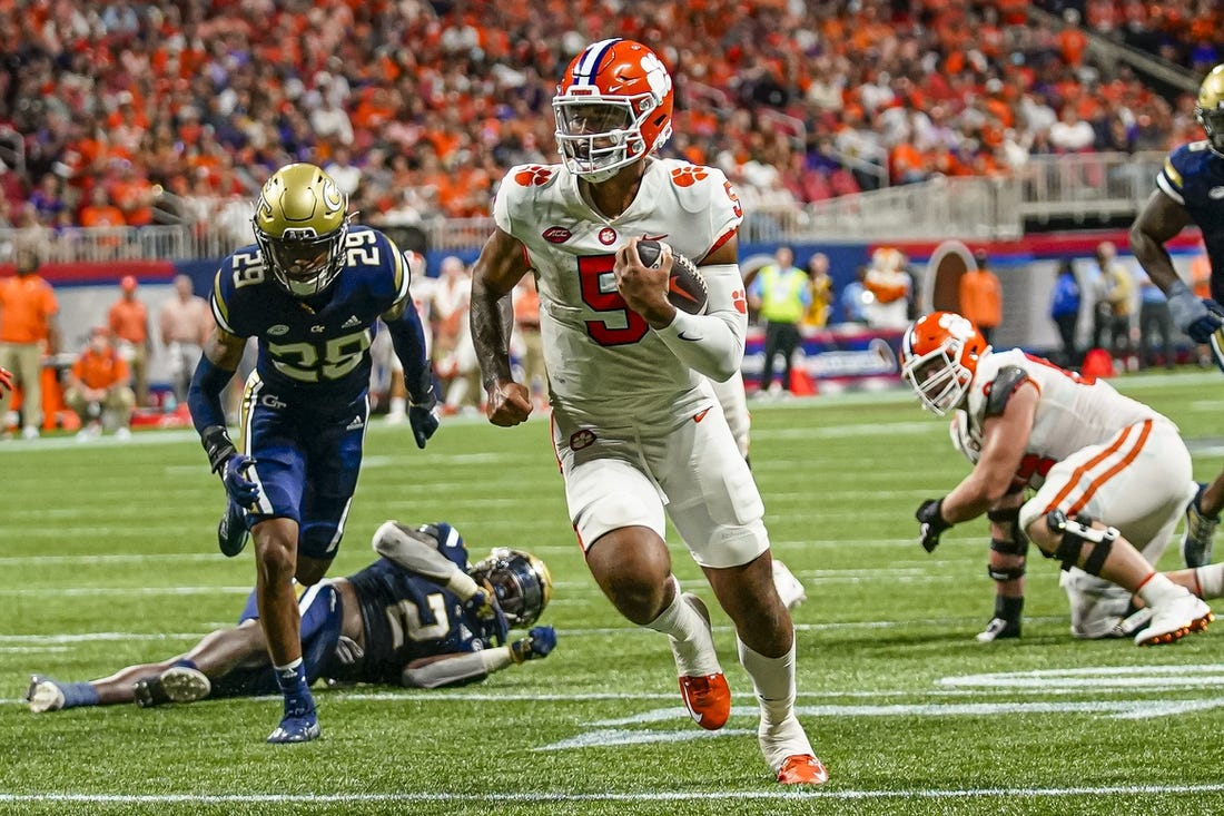 Sep 5, 2022; Atlanta, Georgia, USA; Clemson Tigers quarterback DJ Uiagalelei (5) runs for a touchdown against the Georgia Tech Yellow Jackets during the second half at Mercedes-Benz Stadium. Mandatory Credit: Dale Zanine-USA TODAY Sports