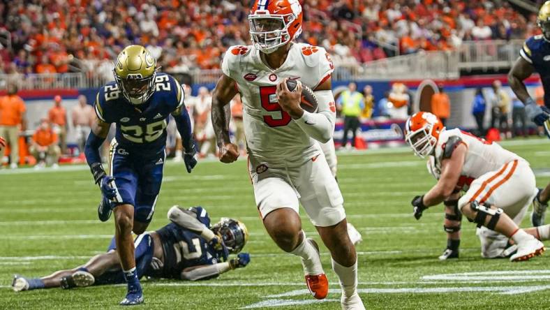 Sep 5, 2022; Atlanta, Georgia, USA; Clemson Tigers quarterback DJ Uiagalelei (5) runs for a touchdown against the Georgia Tech Yellow Jackets during the second half at Mercedes-Benz Stadium. Mandatory Credit: Dale Zanine-USA TODAY Sports