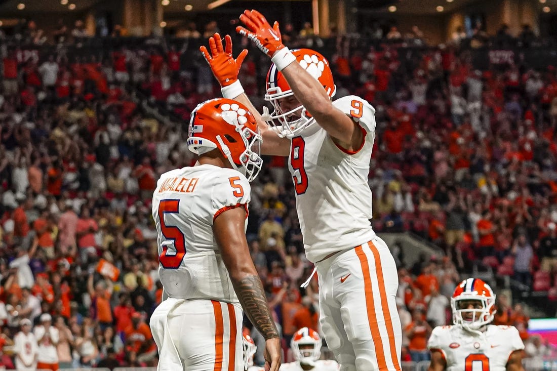 Sep 5, 2022; Atlanta, Georgia, USA; Clemson Tigers quarterback DJ Uiagalelei (5) reacts with tight end Jake Briningstool (9) after running for a touchdown against the Georgia Tech Yellow Jackets during the second half at Mercedes-Benz Stadium. Mandatory Credit: Dale Zanine-USA TODAY Sports
