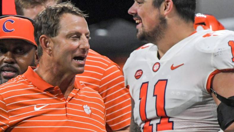 Clemson head coach Dabo Swinney reacts near defensive lineman Bryan Bresee (11) after the game at the Mercedes-Benz Stadium in Atlanta, Georgia Monday, September 5, 2022. Clemson won 41-10.

Ncaa Fb Clemson At Georgia Tech