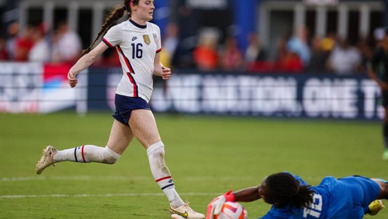 Sep 6, 2022; Washington, District of Columbia, USA; Nigeria goalkeeper Chiamaka Nnadozie (16) makes a save against United States midfielder Rose Lavelle (16) during the first half at Audi Field. Mandatory Credit: Scott Taetsch-USA TODAY Sports