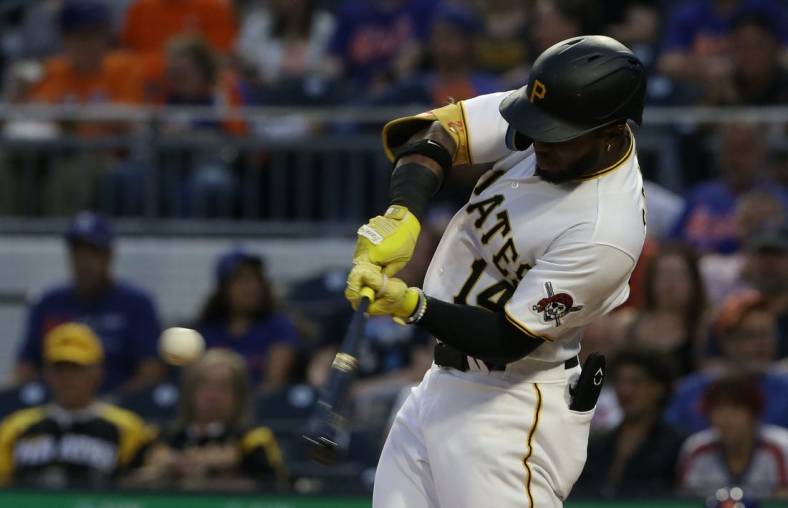 Sep 6, 2022; Pittsburgh, Pennsylvania, USA;  Pittsburgh Pirates designated hitter Rodolfo Castro (14) hits a two run home run against the New York Mets during the third inning at PNC Park. Mandatory Credit: Charles LeClaire-USA TODAY Sports