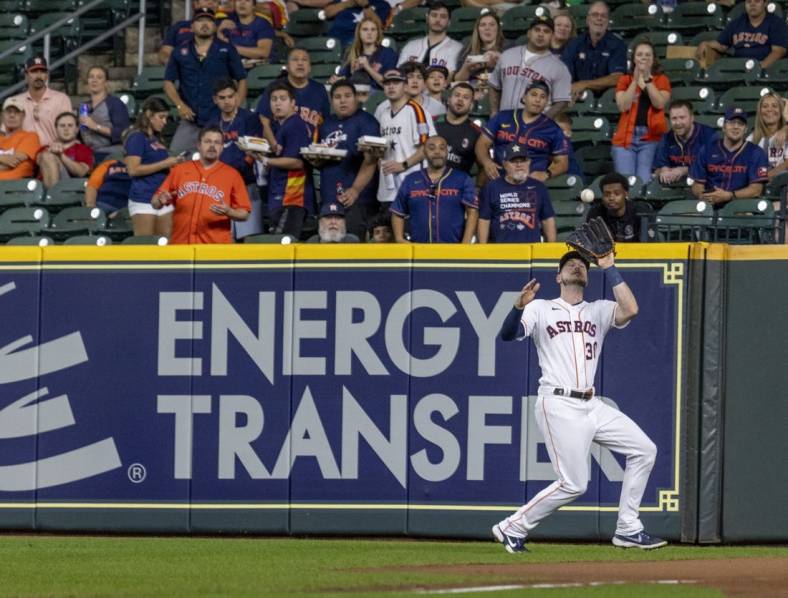 Sep 6, 2022; Houston, Texas, USA;  Houston Astros right fielder Kyle Tucker (30) catcher Texas Rangers right fielder Adolis Garcia (53) (not pictured) fly ball in the first inning at Minute Maid Park. Mandatory Credit: Thomas Shea-USA TODAY Sports