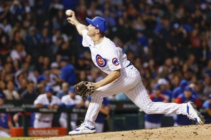 Sep 6, 2022; Chicago, Illinois, USA; Chicago Cubs relief pitcher Hayden Wesneski (19) delivers against the Cincinnati Reds during the fifth inning at Wrigley Field. Mandatory Credit: Kamil Krzaczynski-USA TODAY Sports