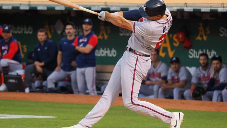 Sep 6, 2022; Oakland, California, USA; Atlanta Braves first baseman Matt Olson (28) hits a three-run home run against the Oakland Athletics during the third inning at RingCentral Coliseum. Mandatory Credit: Kelley L Cox-USA TODAY Sports