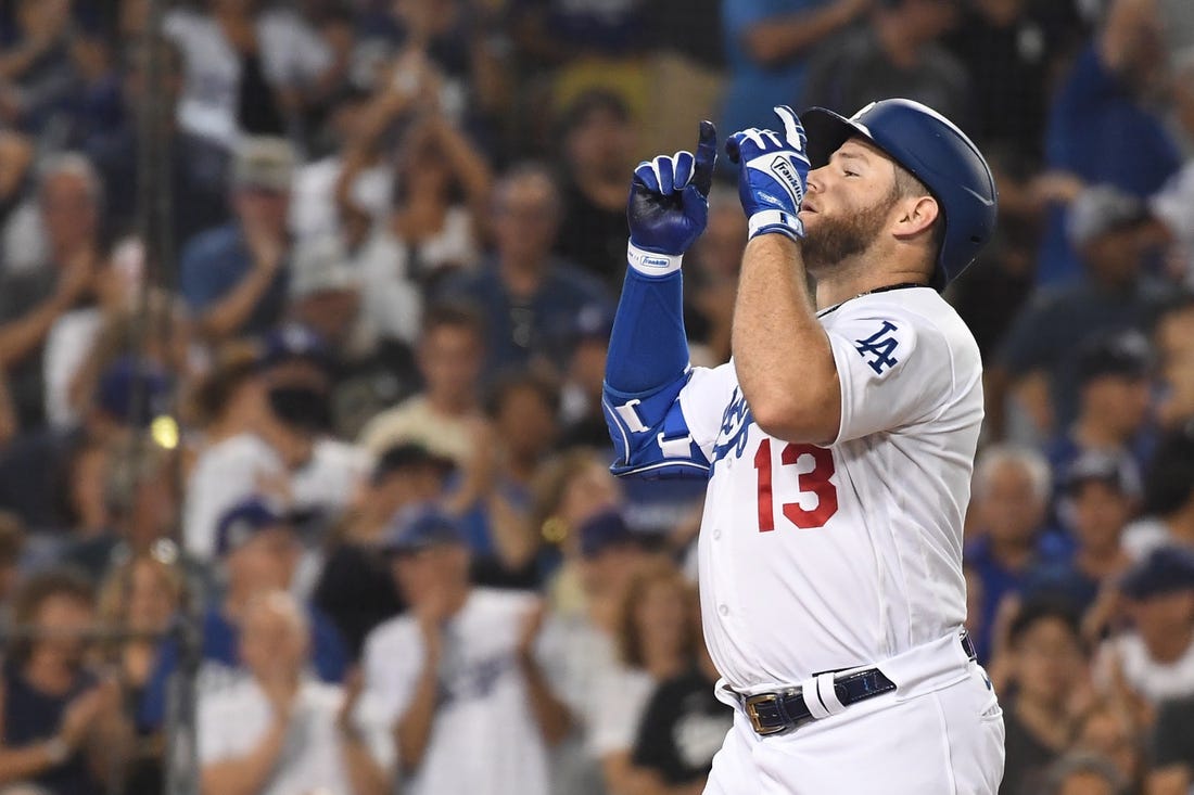 Sep 6, 2022; Los Angeles, California, USA; Los Angeles Dodgers third baseman Max Muncy (13) celebrates hitting a two-run home run against the San Francisco Giants at Dodger Stadium. Mandatory Credit: Richard Mackson-USA TODAY Sports