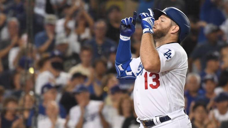 Sep 6, 2022; Los Angeles, California, USA; Los Angeles Dodgers third baseman Max Muncy (13) celebrates hitting a two-run home run against the San Francisco Giants at Dodger Stadium. Mandatory Credit: Richard Mackson-USA TODAY Sports