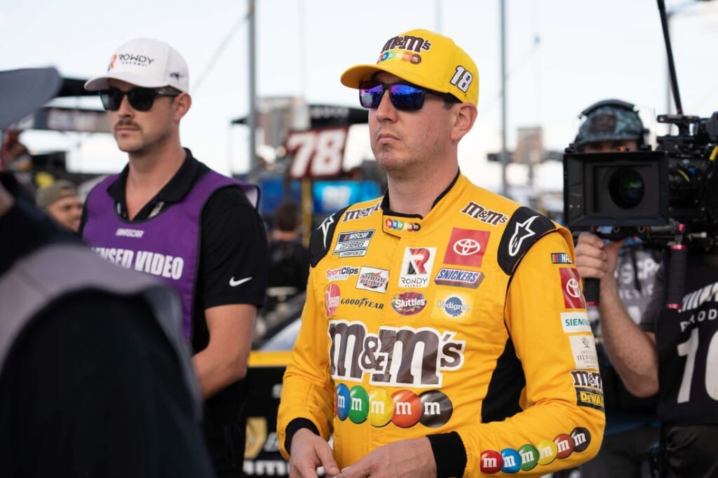 Sep 4, 2022; Darlington, South Carolina, USA; Kyle Busch, driver of the (18) M&M's Toyota, arrives for driver introductions prior to the COOK OUT Southern 500 at Darlington Raceway. Mandatory Credit: David Yeazell-USA TODAY Sports