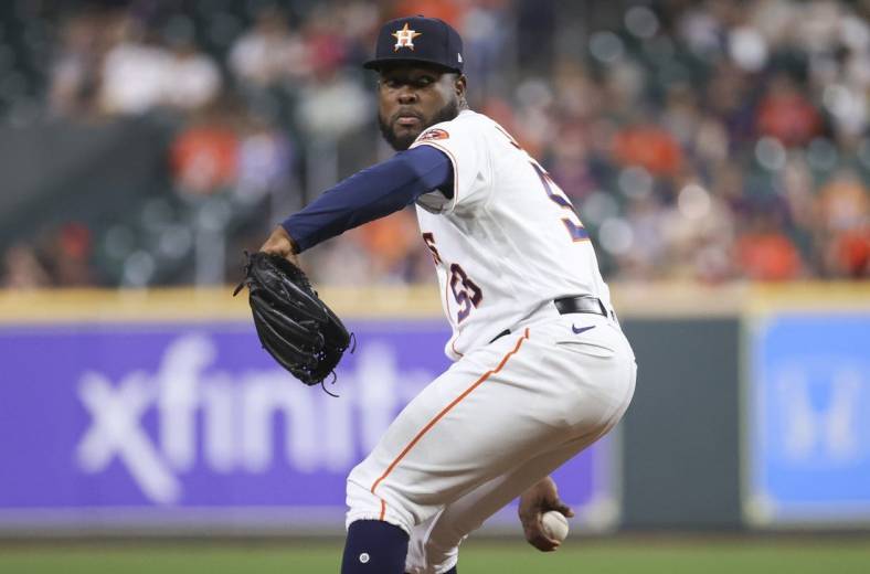 Sep 7, 2022; Houston, Texas, USA; Houston Astros starting pitcher Cristian Javier (53) delivers a pitch during the third inning against the Texas Rangers at Minute Maid Park. Mandatory Credit: Troy Taormina-USA TODAY Sports