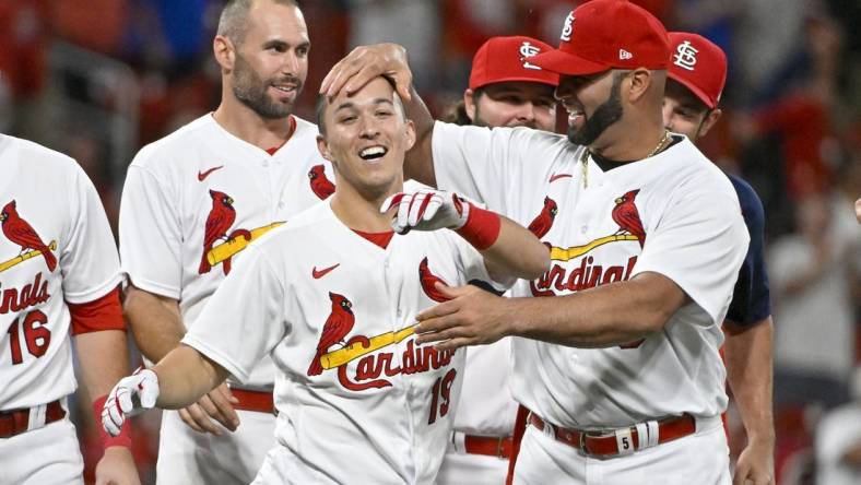 Sep 7, 2022; St. Louis, Missouri, USA;  St. Louis Cardinals shortstop Tommy Edman (19) celebrates with Albert Pujols (5) after hitting a walk-off two run double against the Washington Nationals during the ninth inning at Busch Stadium. Mandatory Credit: Jeff Curry-USA TODAY Sports