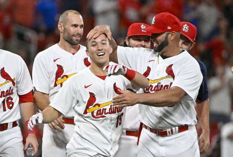 Sep 7, 2022; St. Louis, Missouri, USA;  St. Louis Cardinals shortstop Tommy Edman (19) celebrates with Albert Pujols (5) after hitting a walk-off two run double against the Washington Nationals during the ninth inning at Busch Stadium. Mandatory Credit: Jeff Curry-USA TODAY Sports