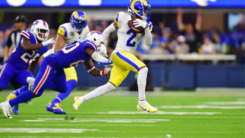 Sep 8, 2022; Inglewood, California, USA; Los Angeles Rams cornerback Troy Hill (2) runs the ball after an interception in the second quarter at SoFi Stadium. Mandatory Credit: Gary A. Vasquez-USA TODAY Sports