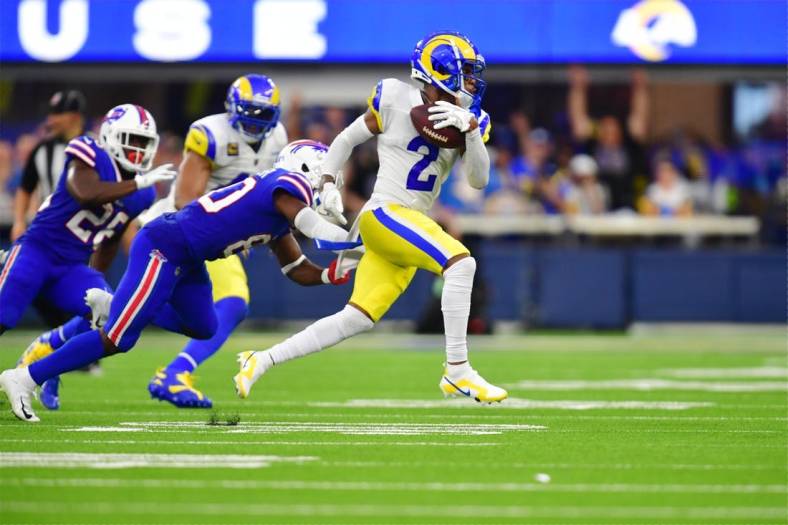 Sep 8, 2022; Inglewood, California, USA; Los Angeles Rams cornerback Troy Hill (2) runs the ball after an interception in the second quarter at SoFi Stadium. Mandatory Credit: Gary A. Vasquez-USA TODAY Sports