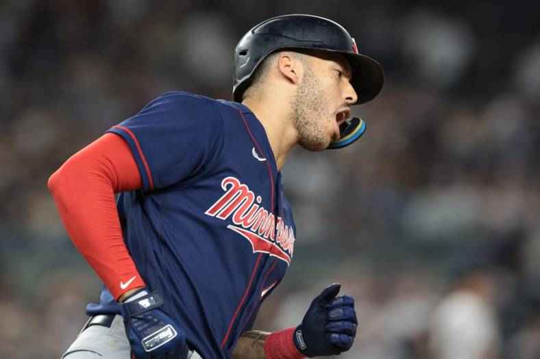Sep 8, 2022; Bronx, New York, USA; Minnesota Twins shortstop Carlos Correa (4) reacts after hitting a two-run home run during the eighth inning against the New York Yankees at Yankee Stadium. Mandatory Credit: Vincent Carchietta-USA TODAY Sports